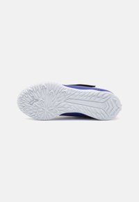 Purple sports shoe with a textured white rubber outsole. Features a black strap and a sleek design, ideal for athletic activities.