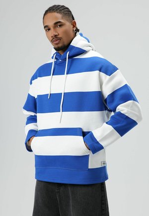 Blauw-wit gestreepte hoodie met een capuchon en trekkoord, een voorkantzak en geribbelde manchetten. Gemaakt van zachte stof, losvallend ontwerp.