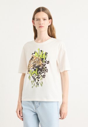 White cotton t-shirt featuring a leopard graphic and "Wild Soul" text in green, with black spots and subtle green accents on the design.