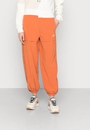 ALL TERRAIN - Tracksuit bottoms - soft copper