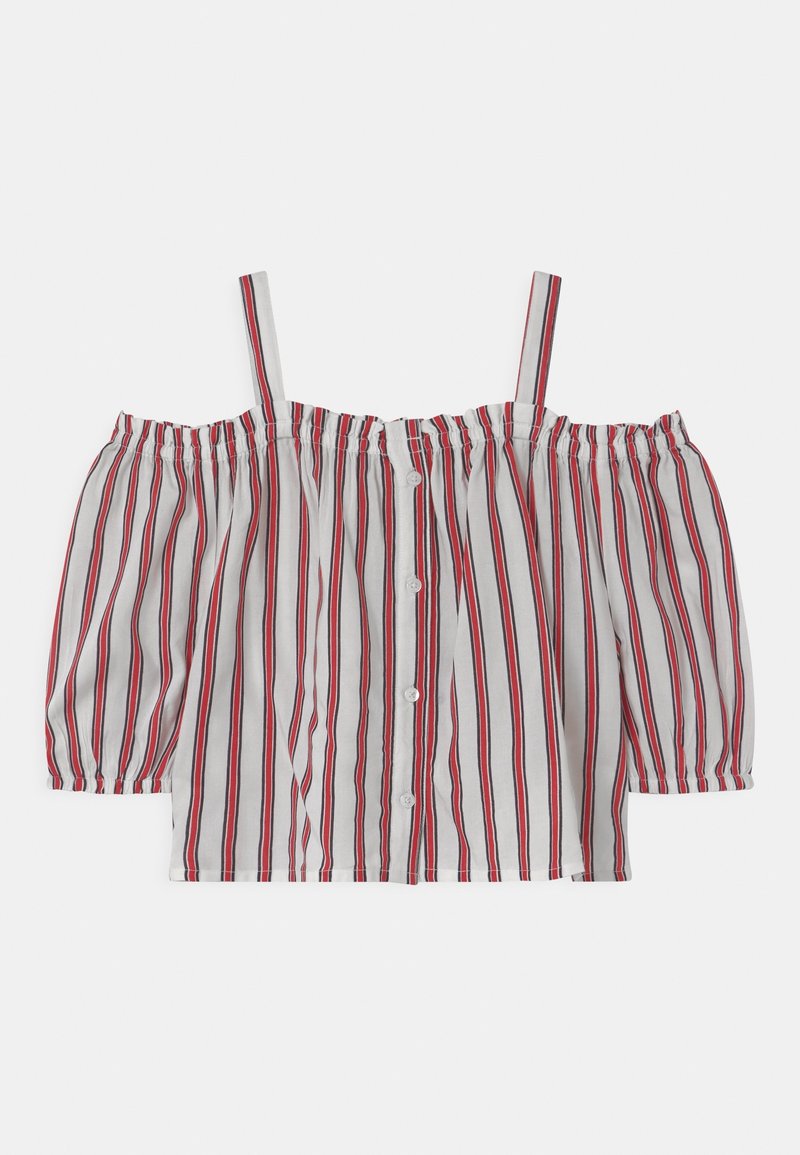 Blouse blanche épaule nue avec rayures verticales rouges et noires, devant boutonné, manches élastiquées et fines bretelles.