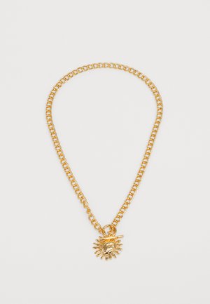 Gold-toned chain necklace featuring a sun pendant with detailed rays, smooth texture, and connecting hardware.