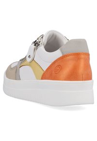 Multicolored sneaker featuring a mix of white, gray, yellow, and orange leather with a textured design, white sole, and zip closure.