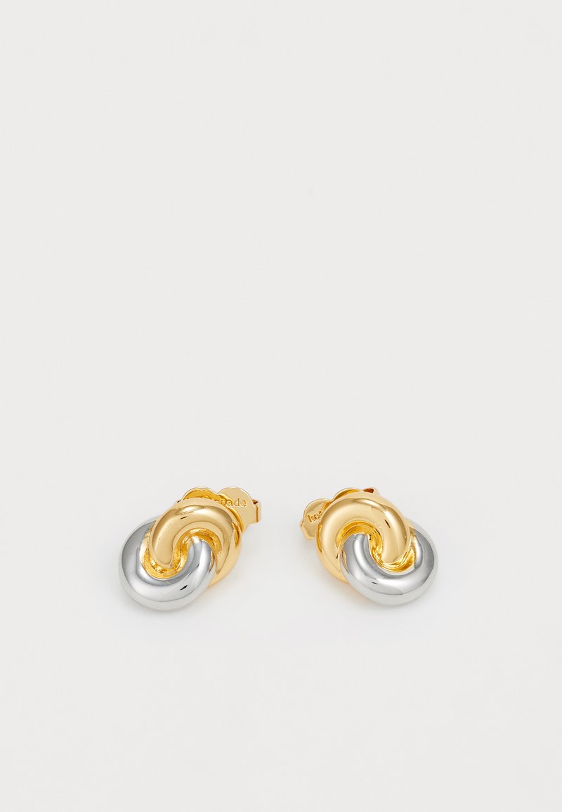 Gold and silver knot-shaped earrings with smooth surfaces and a polished finish, featuring a secure backing for wear.