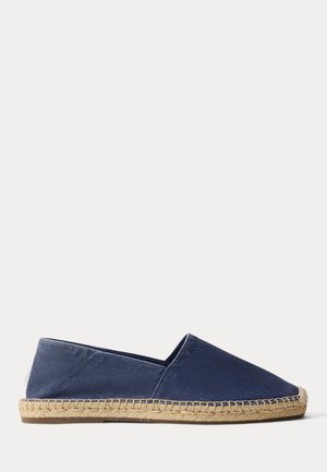 Navy blue canvas espadrille with natural jute rope sole and rubber outsole, slip-on style with exposed stitching along the sole.