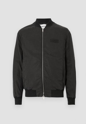 Černá bomber bunda s předním zipem, žebrovanými manžetami a malou vyšívanou nášivkou s logem. Vyrobena z hladké, lehké látky.