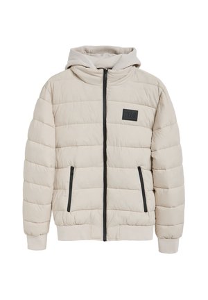Beige puffer jacket with a zip front, attached hood, black accents on zippers, and a patch label. Features quilted texture and elastic cuffs.