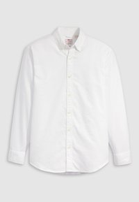 Cămașă albă cu nasturi, din bumbac, cu mâneci lungi, guler și tiv curbat. Prezintă nasturi galbeni și un branding subtil.