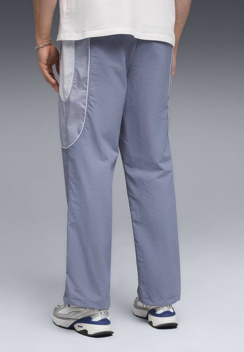 Puma PUMATECH-X RELAXED TRACK PANTS - Teplákové kalhoty - gray sky