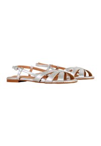 Silver leather sandals with multiple straps and an open design. Brown soles and a buckle closure ensure a secure fit. Flat heel style.