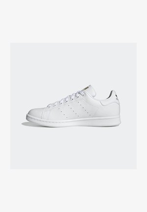 White low-top leather sneaker with lace-up closure, perforated side stripes, and branded heel tab on a plain background.
