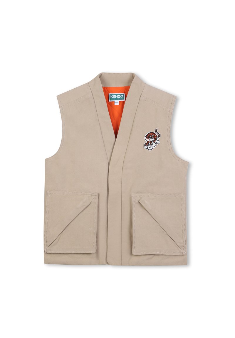 Gilet beige sans manches, col en V profond, deux poches plaquées à l'avant, et un design brodé avec un tigre et des vagues. Doublure intérieure orange.
