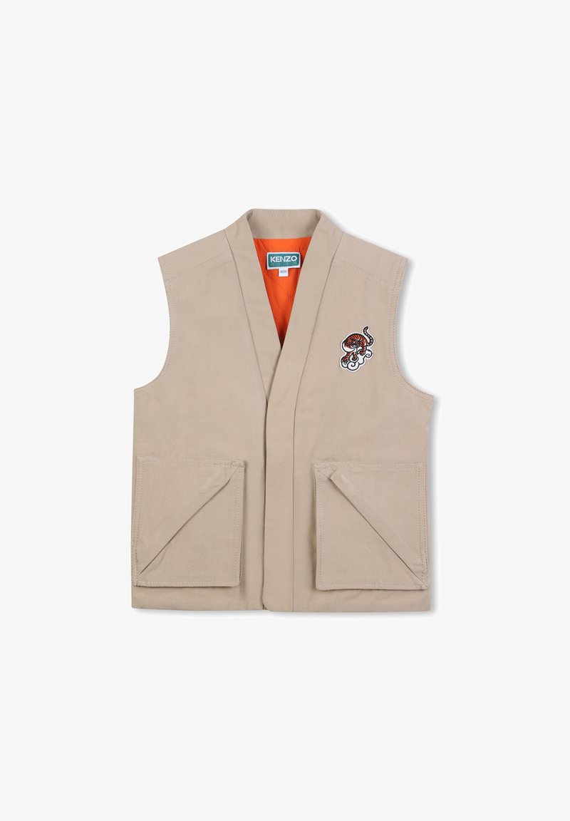 Beige vest zonder mouwen, diepe V-hals, twee voorzakken en een geborduurd ontwerp met een tiger en golven. De binnenvoering is oranje.