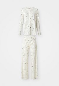 Conjunto de pijama blanco con lunares negros, que incluye una camisa de botón de manga larga y pantalones con cintura elástica. Tela suave y transpirable.