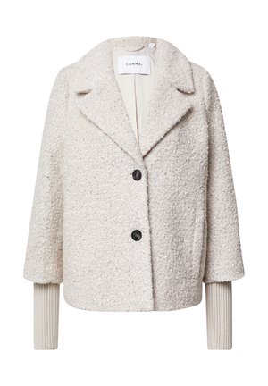 Kurze, cremefarbene Jacke aus strukturiertem Stoff, breite Revers, zwei schwarze Knöpfe und gerippte Manschetten. Gefütterter Innenraum, minimalistisches Design.