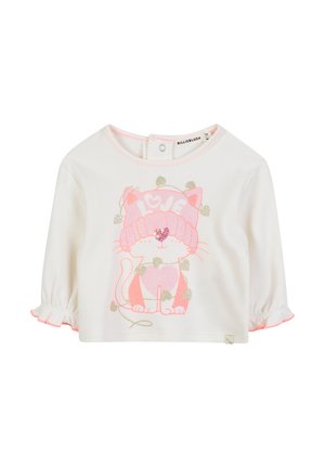 Blouse en coton blanc à manches 3/4, avec des détails rose et un graphique scintillant d'un chat portant un chapeau, entouré de cœurs. Fermeture par bouton-pression au dos.