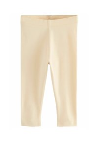 Roomkleurige knielange leggings van zacht, rekbaar materiaal met een elastische tailleband en nette, afgewerkte naden.