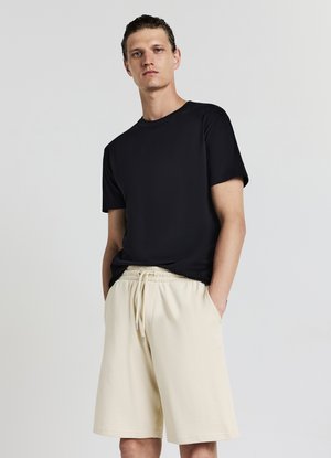 Calliope GINNICO - Pantaloni sportivi - beige chiaro