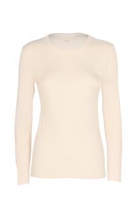 Top a maniche lunghe in morbido tessuto crema a coste. Caratterizzato da un collo rotondo e una forma aderente, con una consistenza liscia e decorazioni minime.