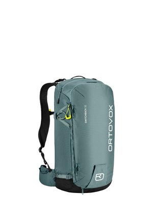 Ortovox Switchback 32 Rucksack in Türkis, mit einem eleganten Design, strukturiertem Stoff, verstellbaren Trägern und leuchtend gelben Akzentdetails.