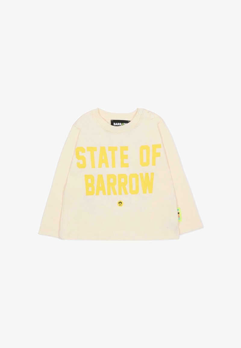 Lichtgeel overhemd met lange mouwen met "STATE OF BARROW" in vette gele letters op de voorkant gedrukt. Voorzien van drukknoopsluitingen op de schouder.