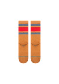 Knee-high socks in tan with a textured finish. Features red, gray, and blue horizontal stripes and a solid blue accent at the toe.
