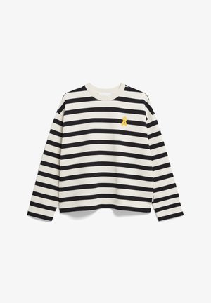 Sweatshirt rayé noir et blanc avec des manches longues, un col rond et un petit emblème jaune sur la poitrine. Fabriqué en tissu en coton doux.