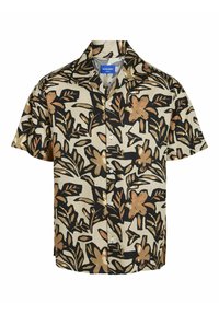 Chemise à manches courtes, à manches boutons, de couleur beige avec un motif floral noir. Possède un col camping et des boutons blancs. Fabriquée en tissu léger.