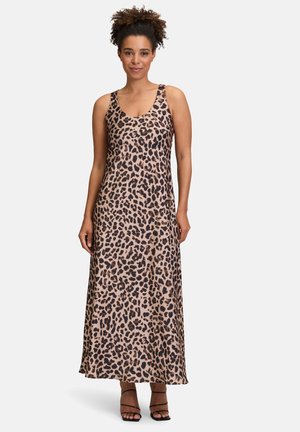 Leopard print maxi dress in tan and brown with a scoop neckline and thin straps, made from smooth, lightweight fabric.