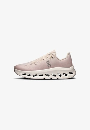 Light pink athletic shoe with a textured upper, lace closure, and a cushioned sole featuring cutouts for airflow and flexibility.