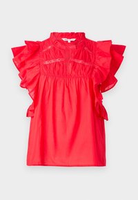 Blouse rouge en coton avec manches volantées, encolure froncée et délicats accents de dentelle. Tissu léger avec une coupe décontractée.