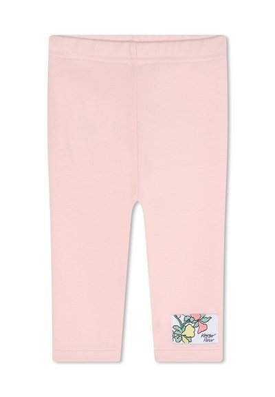 Leggings en coton roses avec une coupe ajustée, ornés d'une étiquette florale sur le côté et d'une texture lisse, idéaux pour un style décontracté ou pour superposer.
