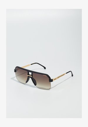 Gafas de sol negras de gran tamaño con lentes degradados, acentos dorados y un diseño geométrico audaz. Montura de metal ligera con brazos curvados.