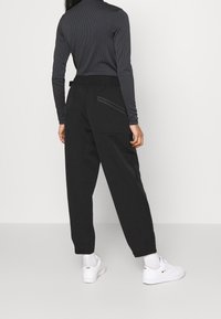 Nike Sportswear Tygbyxor - black