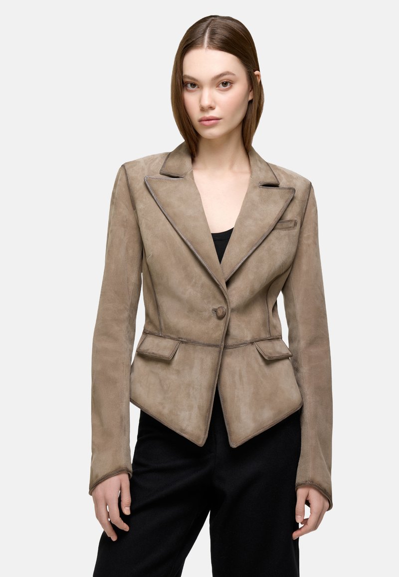 Brown suede blazer with a tailored fit, notched lapels, single-button closure, and two front pockets. Features a smooth texture and defined seams.
