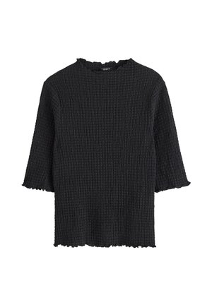 Top nero a maniche corte realizzato in tessuto strutturato con un motivo increspato. Presenta un collo e un orlo a onde.