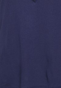 Navy blue short-sleeve t-shirt made of soft fabric, featuring a v-neckline and a subtle, textured surface. No visible patterns or accents.