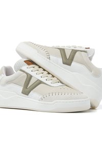 Sneakers in off-white and light green leather with a textured white sole. Features a prominent V logo and decorative stitching on the upper.