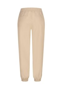 Beige jogger bikses ar elastīgu jostu un aprocēm, kurām ir divi aizmugurējie kabatas. Gluda auduma, ar brīvu piegriezumu un bez redzamām rakstu detaļām.