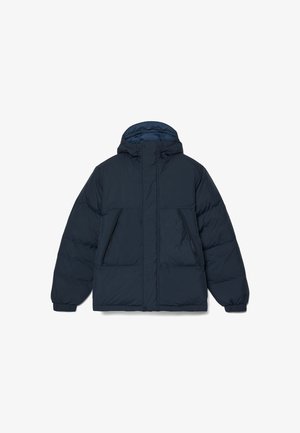Marineblauwe pufferjack met een capuchon, voorzien van een ritssluiting, twee voorklassen en elastische manchetten. Glad oppervlak met een lichtgewicht ontwerp.