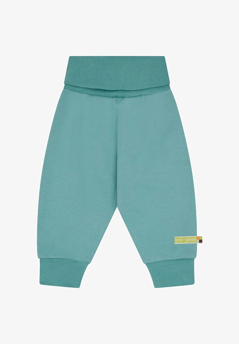 Türkise, weiche Jogginghosen mit einem breiten elastischen Bund, schmalen Bündchen und einem Etikett an der rechten Seite. Hergestellt aus einem bequemen Stoff.