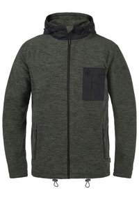 Chaqueta texturizada verde con capucha negra, cremallera frontal y un bolsillo en el pecho. Cuenta con cordones ajustables en el dobladillo y dos bolsillos laterales.