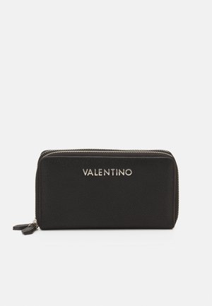 Black leather wallet with a textured finish, silver zipper, and embossed "Valentino" logo on the front. Slim, rectangular shape.