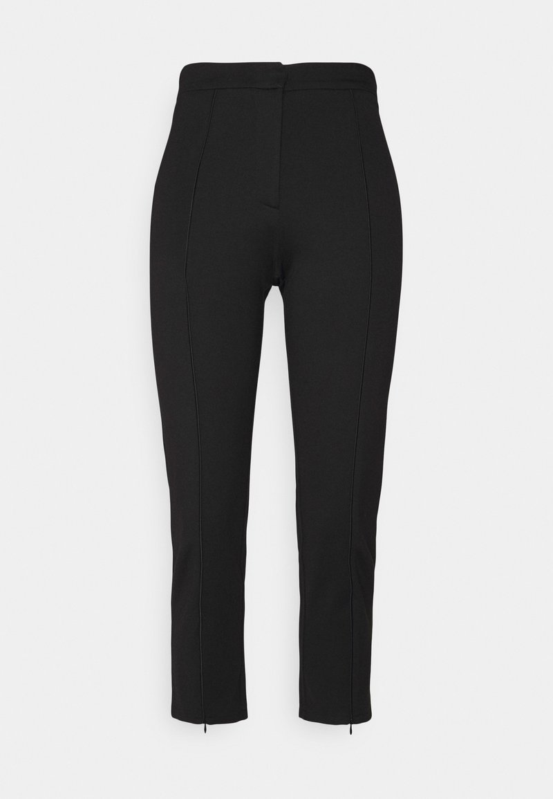 Pantalon noir en matière extensible, avec une taille haute, une coupe slim, des coutures latérales contrastantes et de petites fermetures éclair au niveau de la cheville.