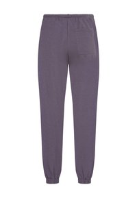 Pantaloni jogging viola realizzati in tessuto morbido, con una vita elasticizzata, polsini a costine e una singola tasca posteriore.