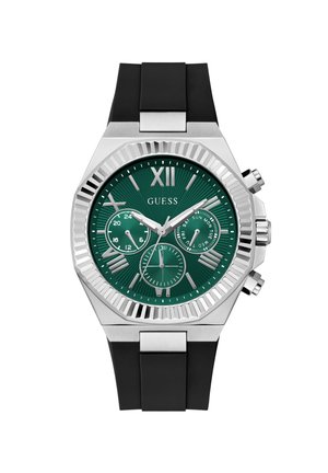 Ανδρικό ρολόι Guess με πράσινο καντράν, ασημένιους ρωμαϊκούς αριθμούς, μαύρο λουράκι από σιλικόνη, τρεις υποκαντράν και ασημένιο στεφάνη με αυλακωτές άκρες.