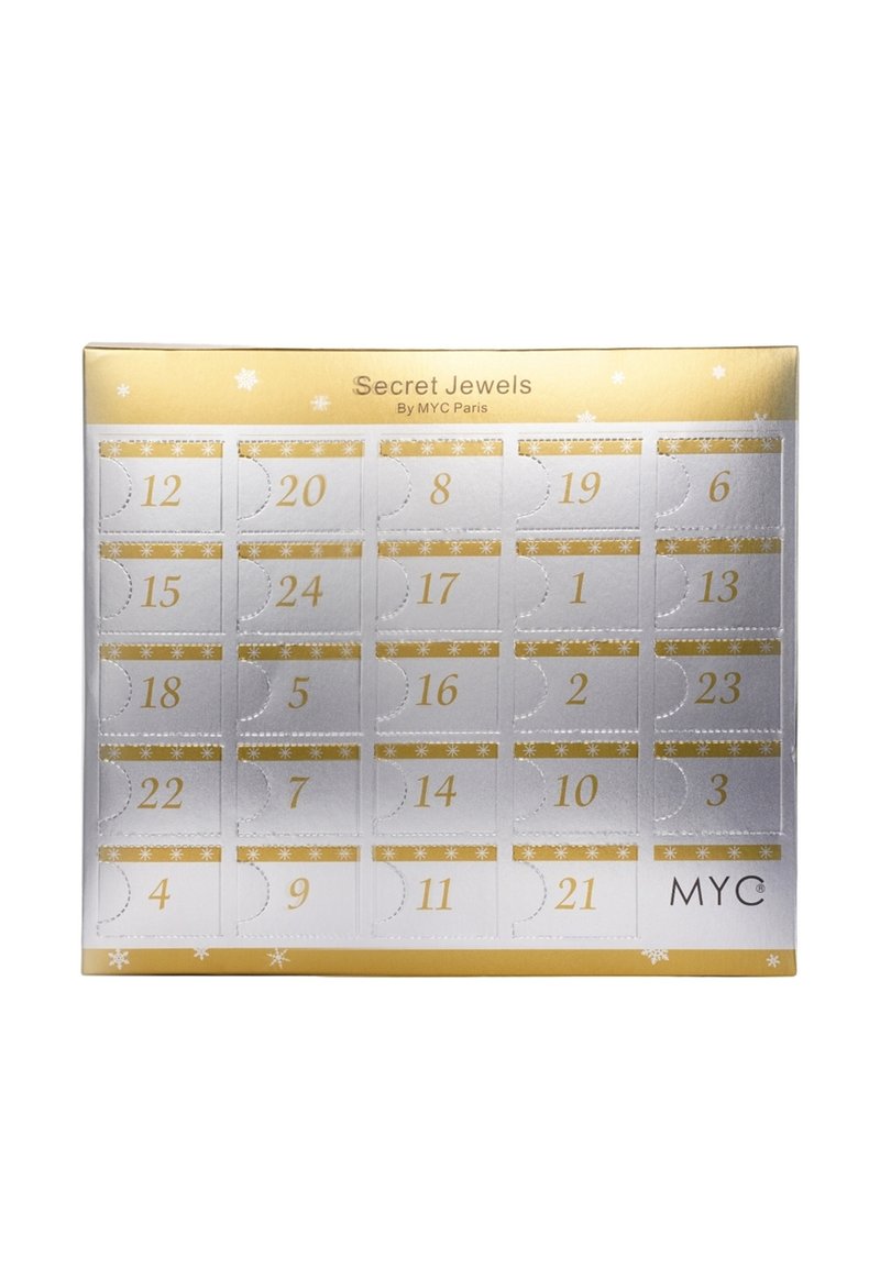 Calendario dell'avvento di gioielli di MYC Paris, caratterizzato da un design in oro e argento con porte numerate e motivi di fiocchi di neve su una scatola rettangolare.
