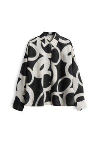 Camicia button-up bianca e nera con motivi circolari astratti, dotata di colletto classico e maniche lunghe con una vestibilità leggermente over.