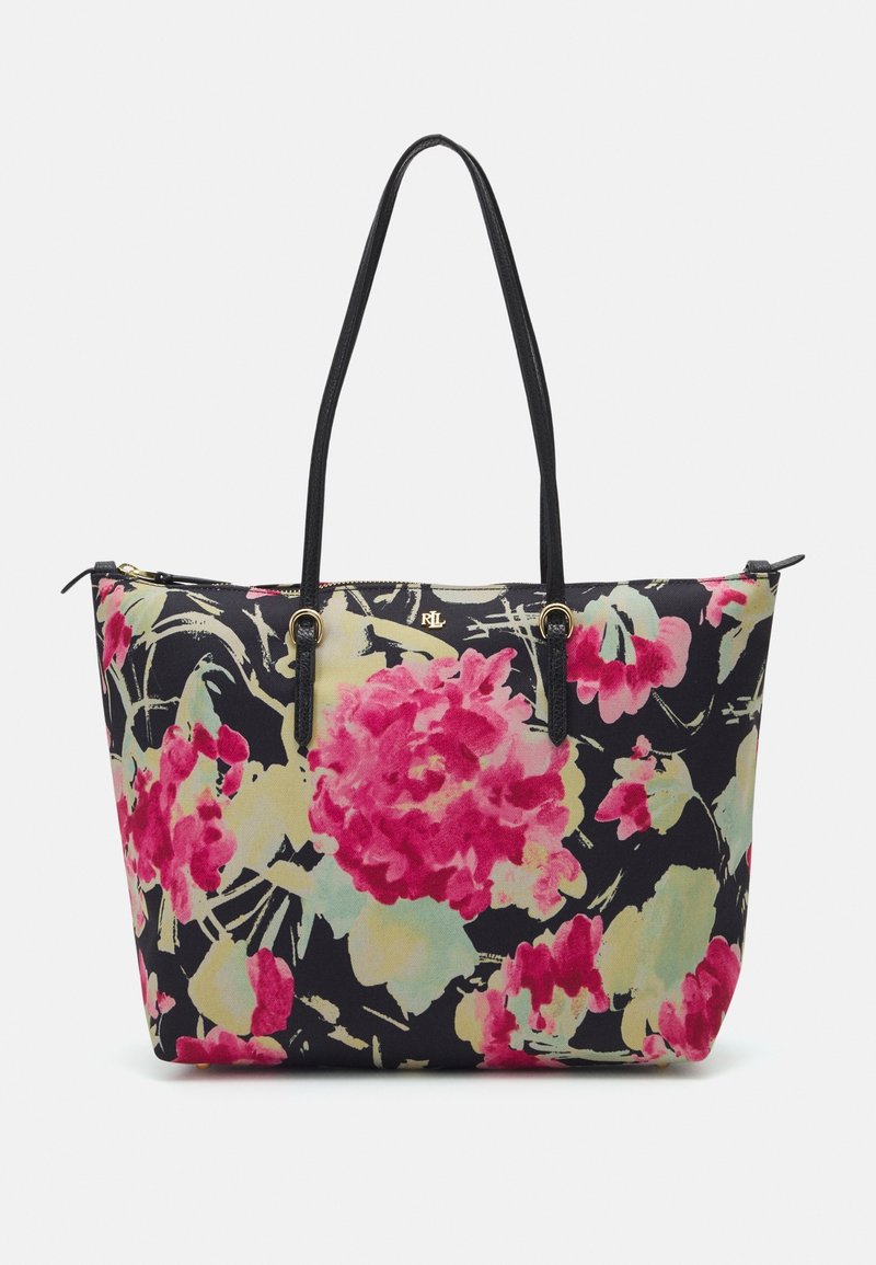 Sac fourre-tout fleuri avec un fond noir, présentant de grandes fleurs roses et vertes, des anses en cuir noir et une fermeture éclair.