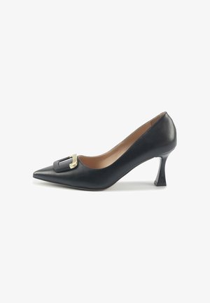 Black leather pointed-toe pump with a gold-accented buckle detail and a distinctive tapered heel. Smooth texture, elegant design.